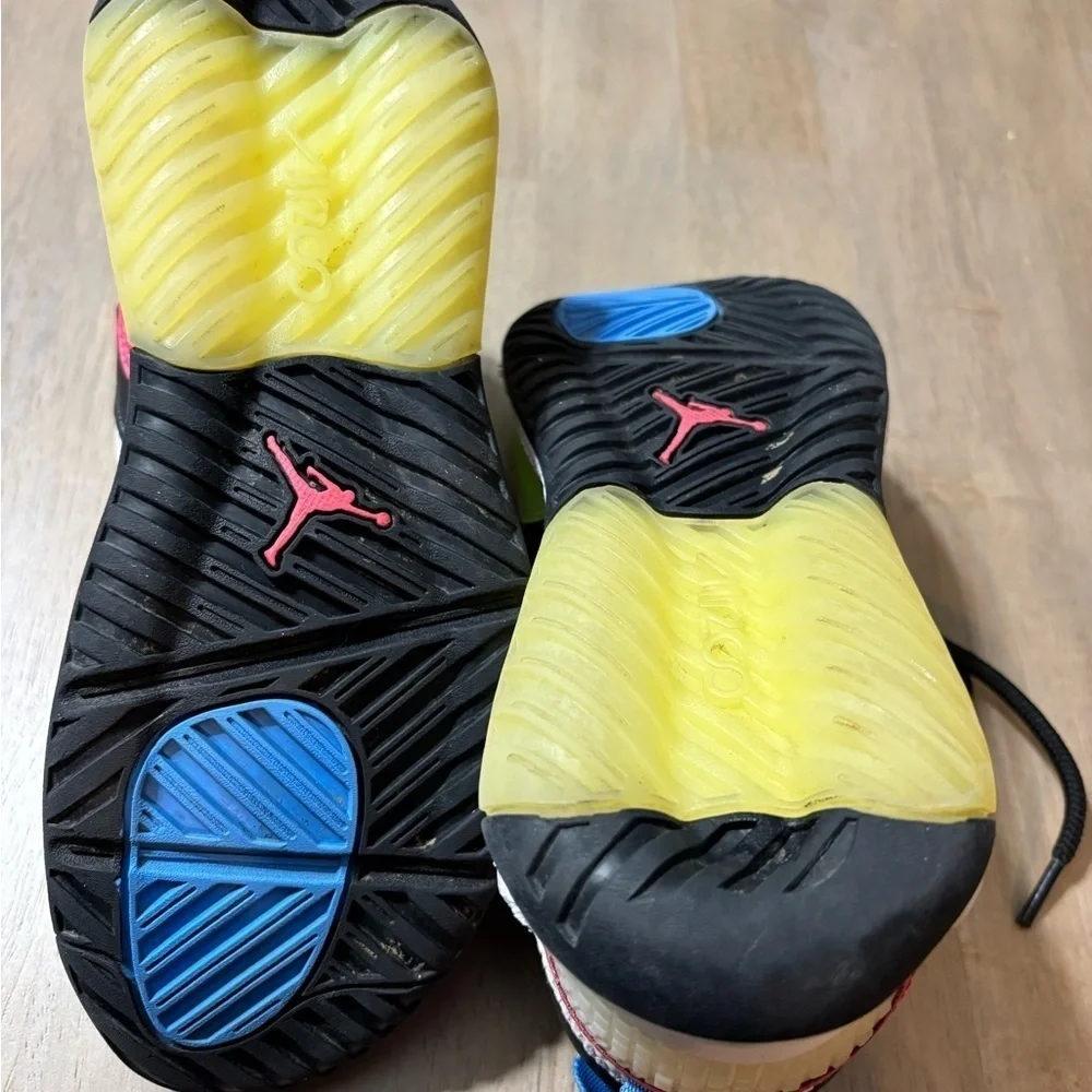 Nike Air Jordan’ size 6 Youth white, black, blue, yellow, pink.